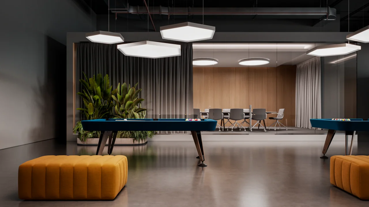 Modern office lounge lit by hexagonal and circular ceiling fixtures, with blue billiard surfaces and orange ottomans